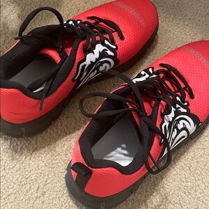 Red Athletic Shoes with Black and White Design